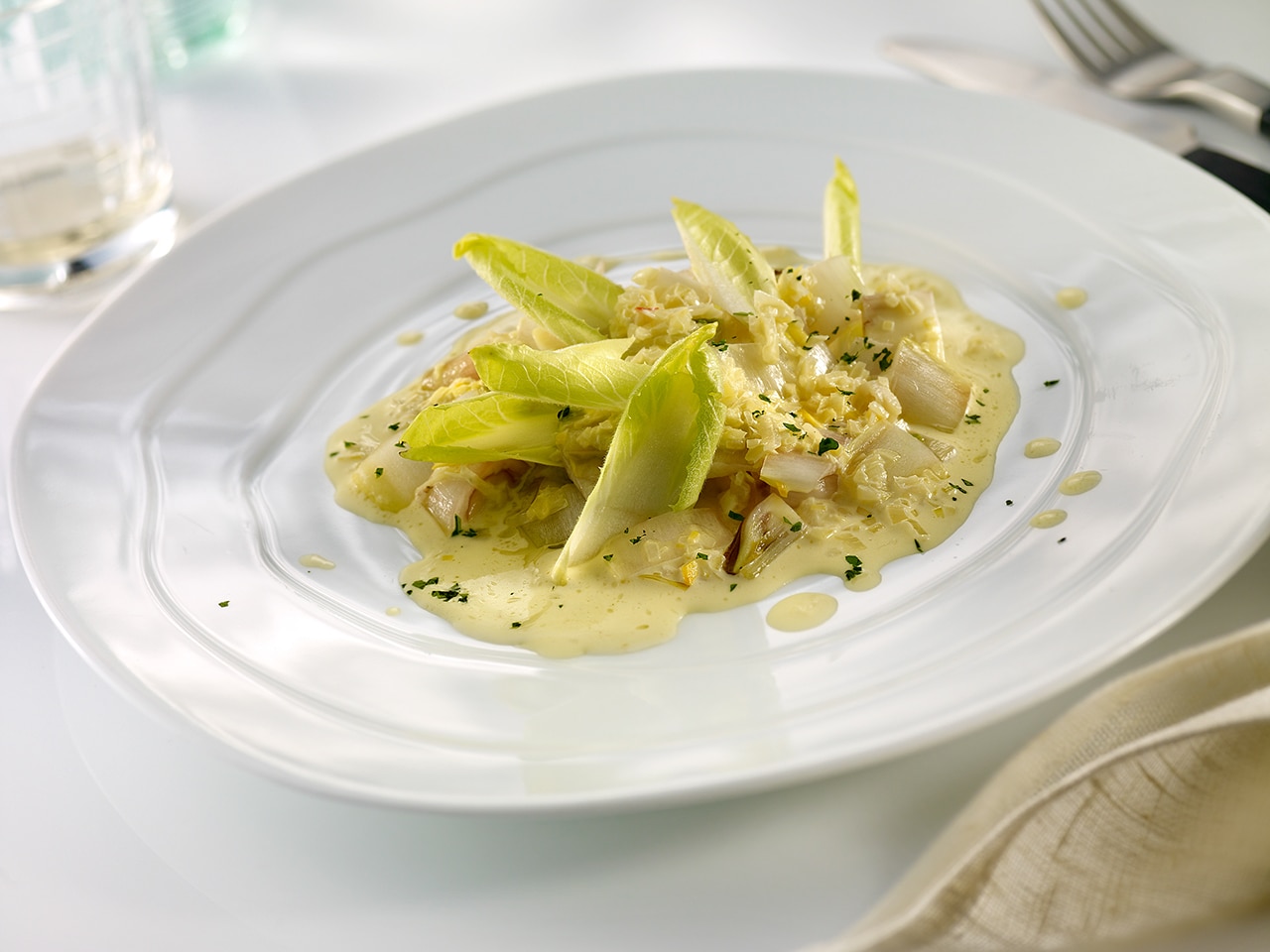 Endivias en crema de azafran y vino blanco