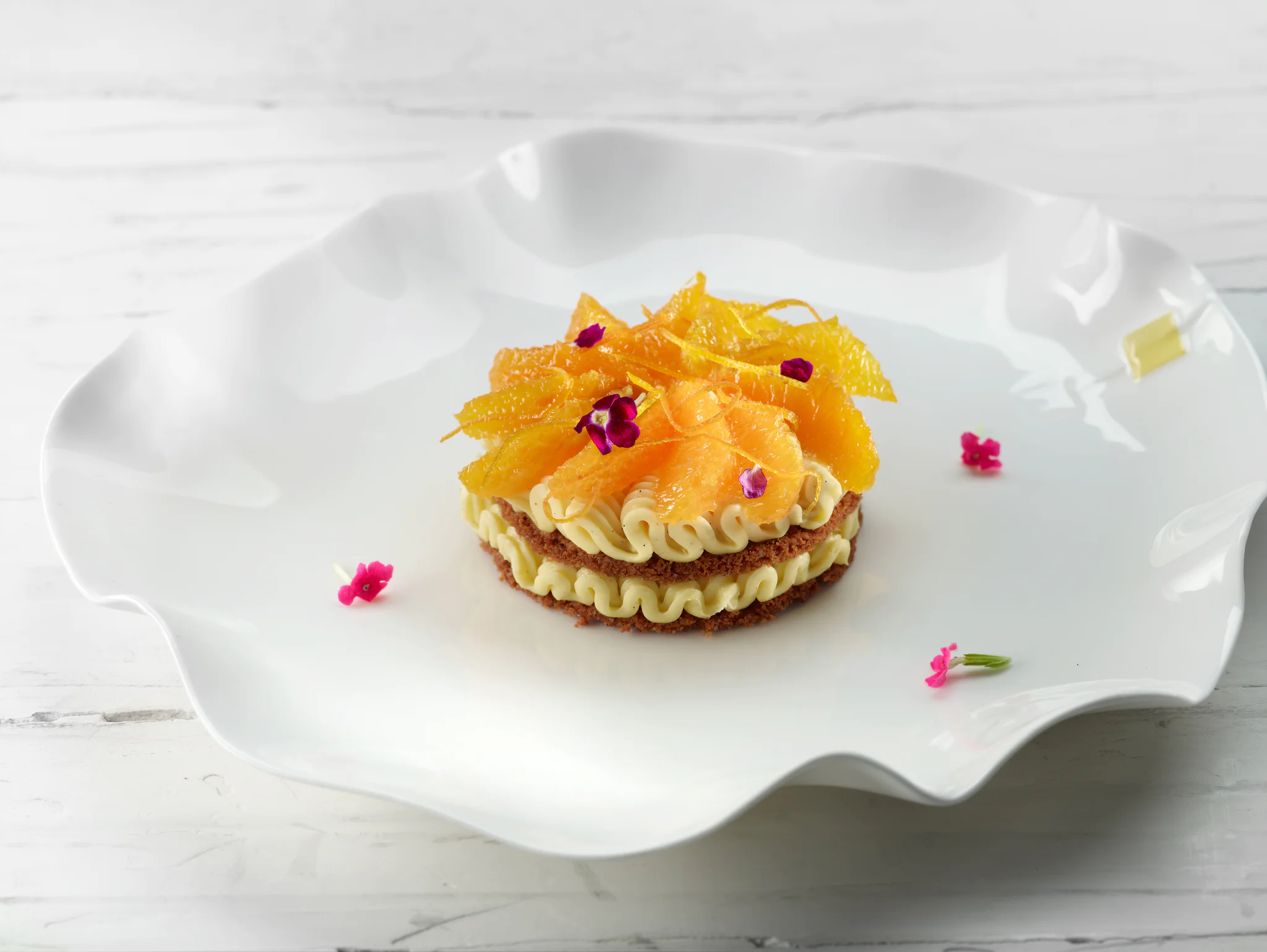 Tartaleta de gajos de naranja confitados